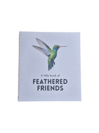 A hardcover copy of "A Little Book of Feathered Friends" by Loren Boyd featuring colorful bird illustrations on the cover. nz