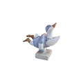 Loren Boyd duck diving through swim ring figurine, detailed sculpture of a duck with a colorful inflatable ring, decorative collectible.