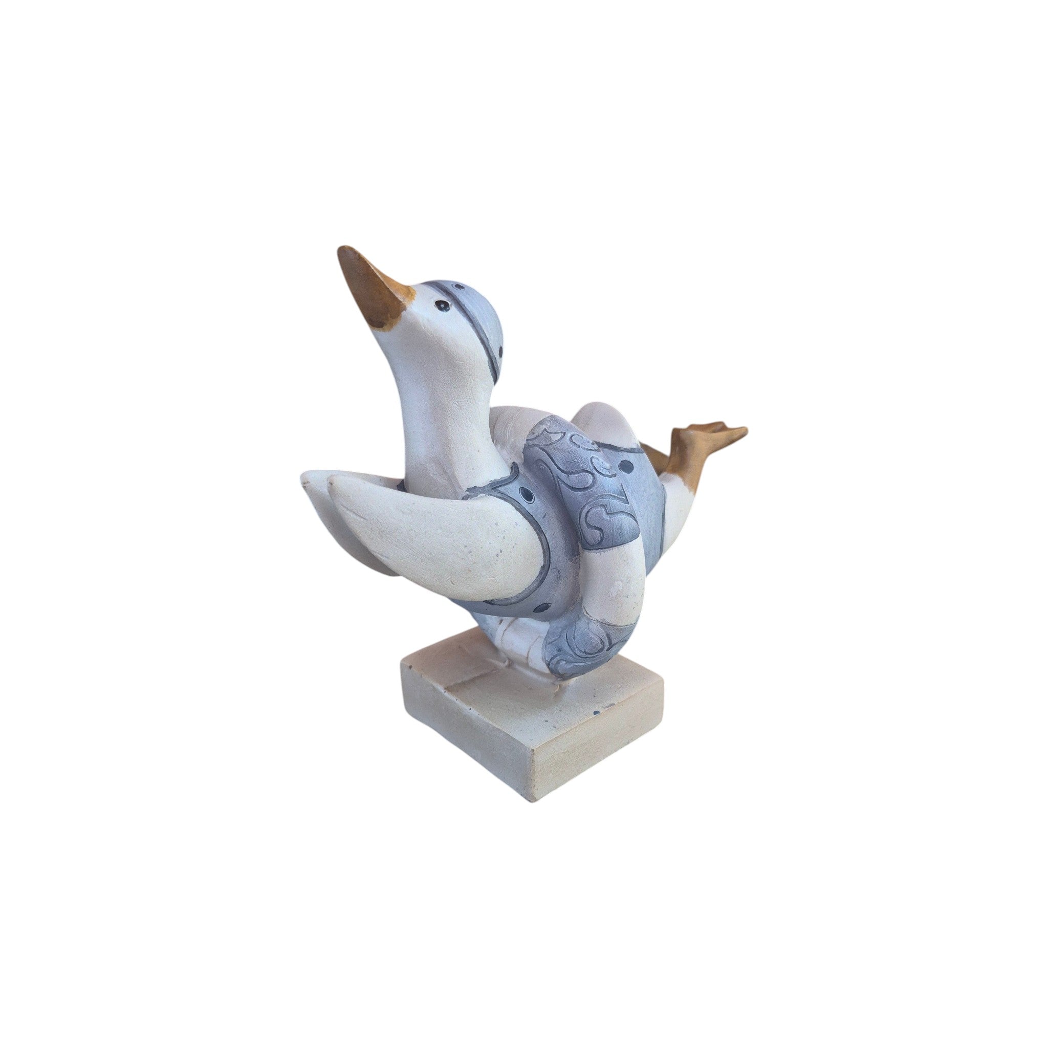 Loren Boyd duck diving through swim ring figurine displayed on a white background, showcasing detailed craftsmanship.