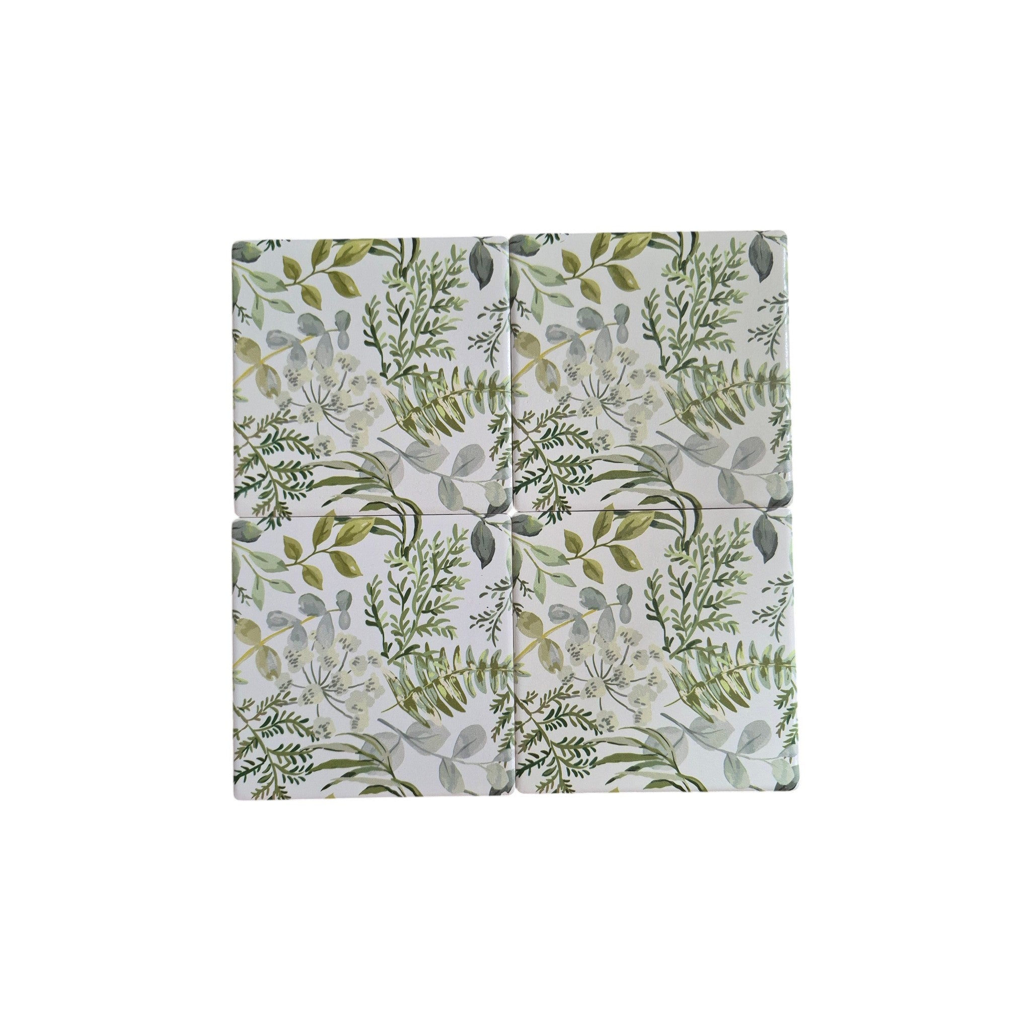 Set of four botanical garden-themed coasters by Loren Boyd featuring vibrant floral and leaf patterns on cork bases. nz