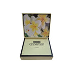 Set of six Cinnamon Frangipani Garden coasters with floral design, perfect for protecting surfaces and adding a touch of nature.