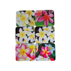 Set of six Cinnamon Frangipani Garden coasters with floral designs, made of durable material for protecting surfaces.