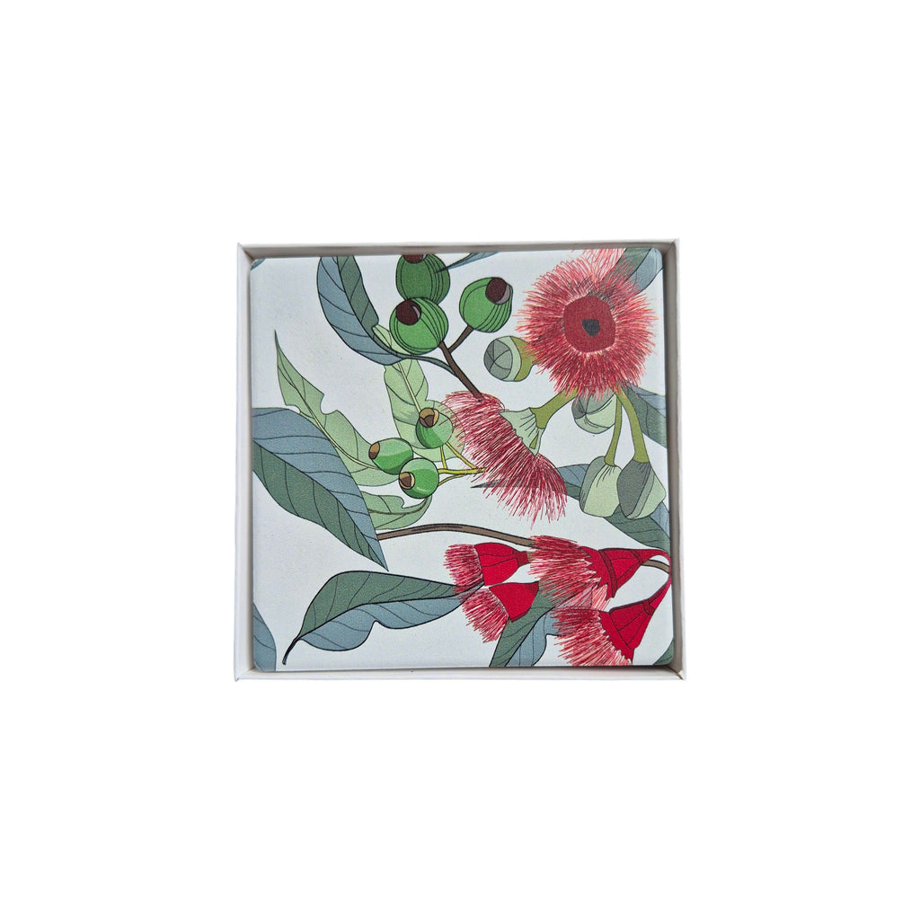 Set of four ceramic Pohutukawa coasters by Loren Boyd featuring floral design, perfect for protecting surfaces from drink spills. nz