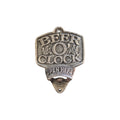Loren Boyd Beer O'Clock cast iron wall bottle opener mounted on a wooden surface for easy bottle opening. nz