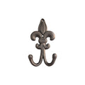 Black Fleur de Lys double wall hook by Loren Boyd, featuring ornate metal design with two hooks for hanging items. nz