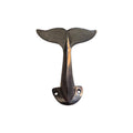 Black whale tail cast iron wall hook by Loren Boyd, featuring a detailed whale tail design for functional wall mounting decor. nz