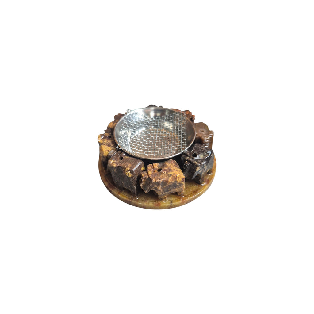 Soapstone burner base without metal bowl showing circle of carved elephants