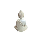 Back view of white resin Buddha figure showing textured hair and patterned robe