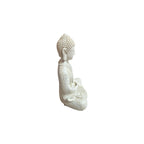 Side view of white resin Earth Touching Gesture Buddha figure