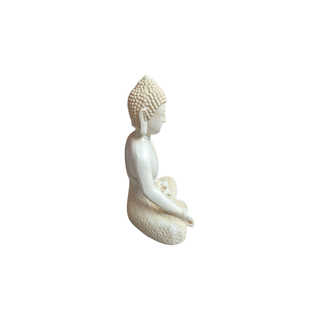 Side view of white resin seated Varada Mudra Buddha figure