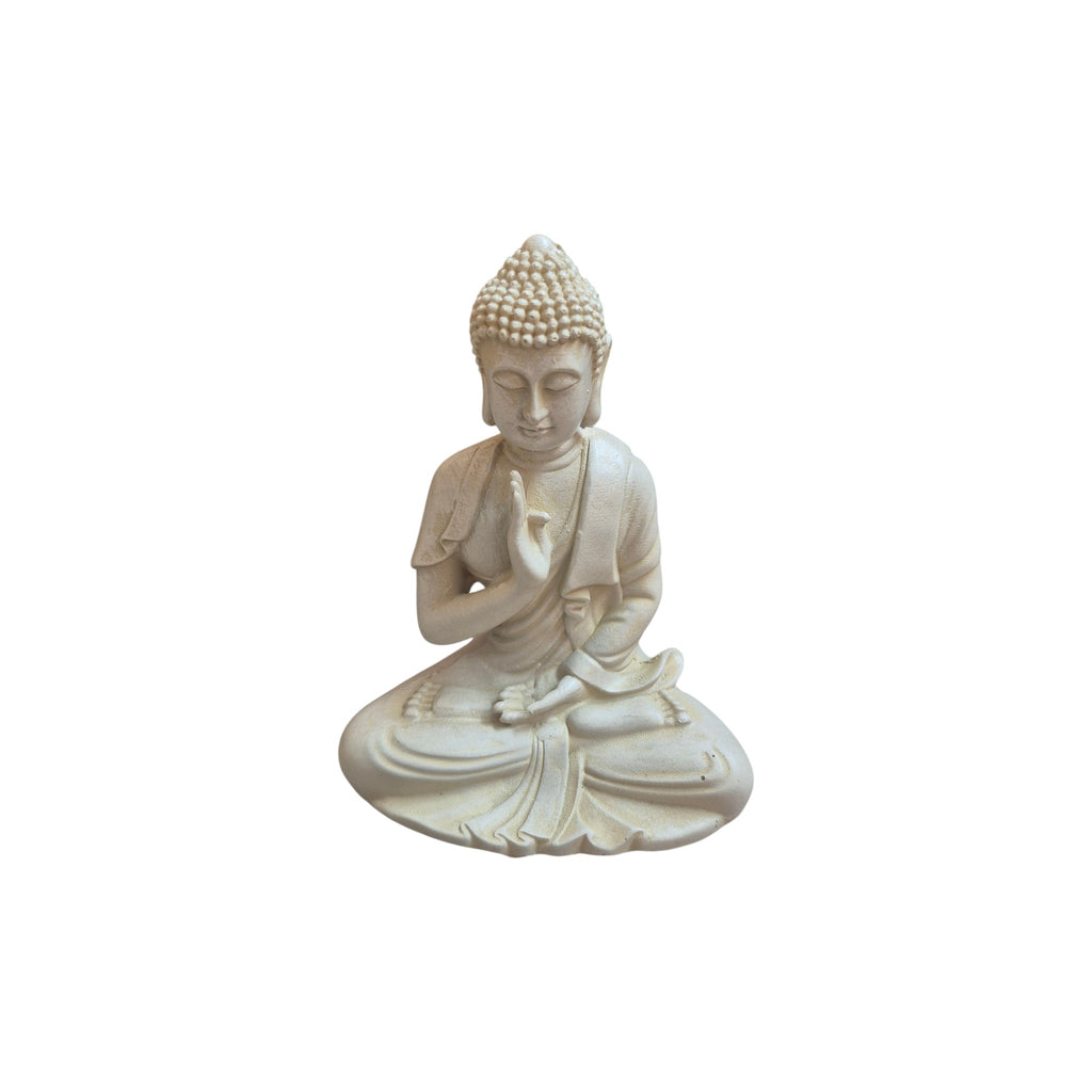 Front view of seated white resin Buddha with one hand raised in a protective gesture