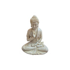 Front view of seated white resin Buddha with one hand raised in a protective gesture