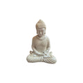 Front view of white resin Buddha seated in meditation with hands resting in lap
