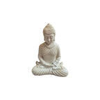 Front view of white resin Buddha seated in meditation with hands resting in lap