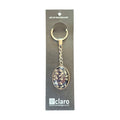 Claro Fern Keychain on display card showing silver oval glass dome with NZ fern pattern nz