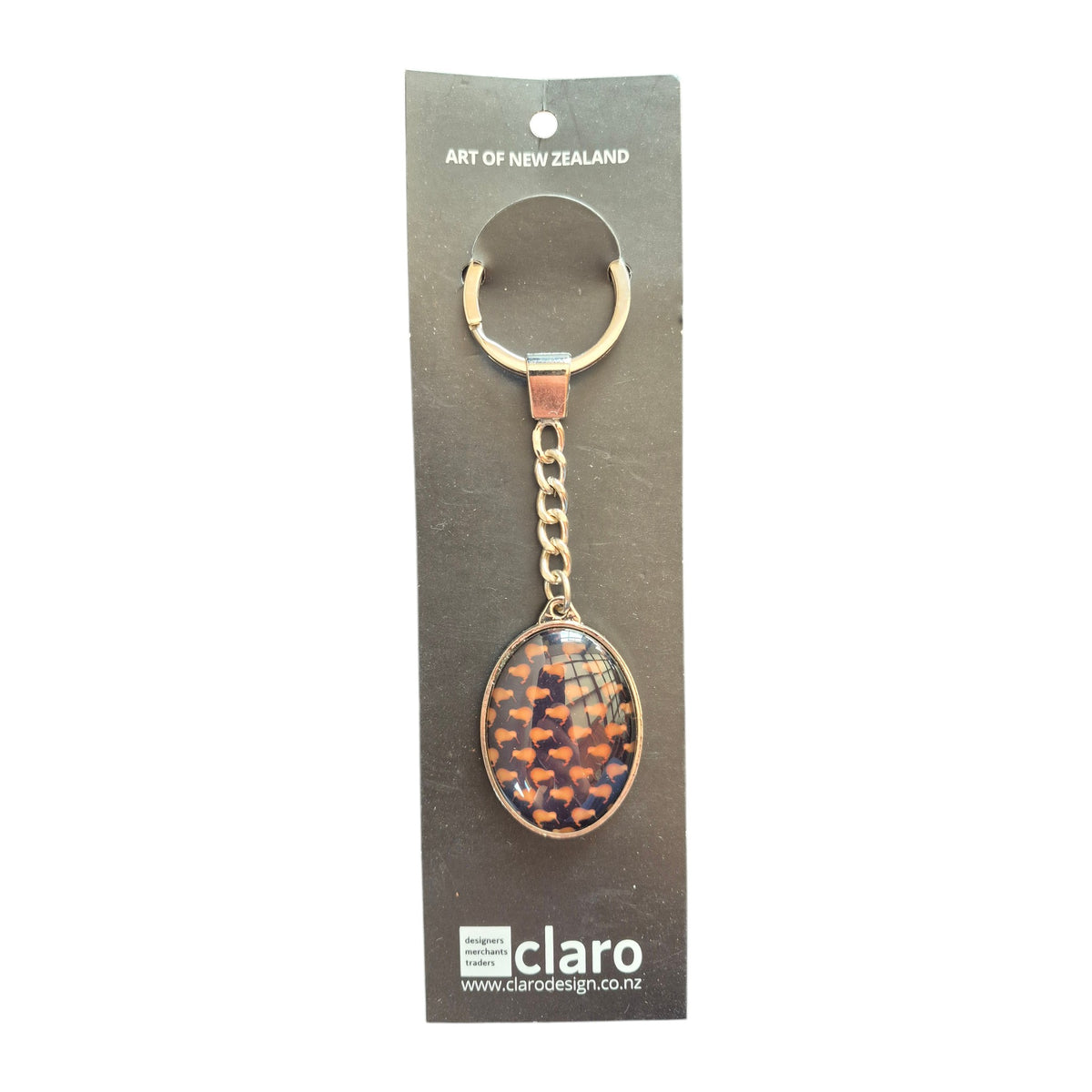 Claro Brown Kiwi Keychain on display card showing silver oval glass dome with repeating kiwi bird pattern