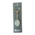Claro Kiwi Slang Keychain on display card showing silver oval glass dome with NZ slang words typography