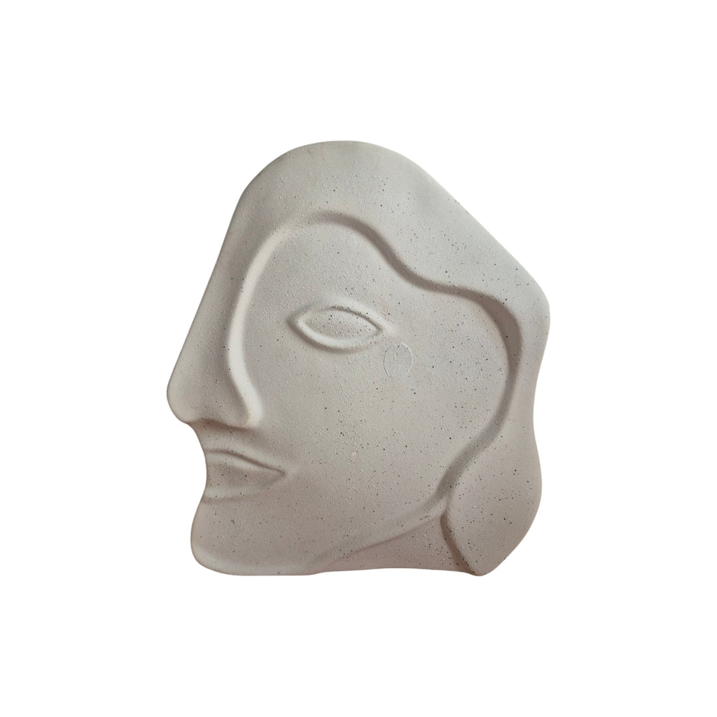 White Face Sandstone Vase front view showing abstract carved face profile with single eye and speckled white finish