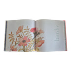 Eternity Healing Quotations and Thoughts hardback book — open spread showing full-colour pink botanical watercolour illustration alongside Oscar Wilde healing quotation
