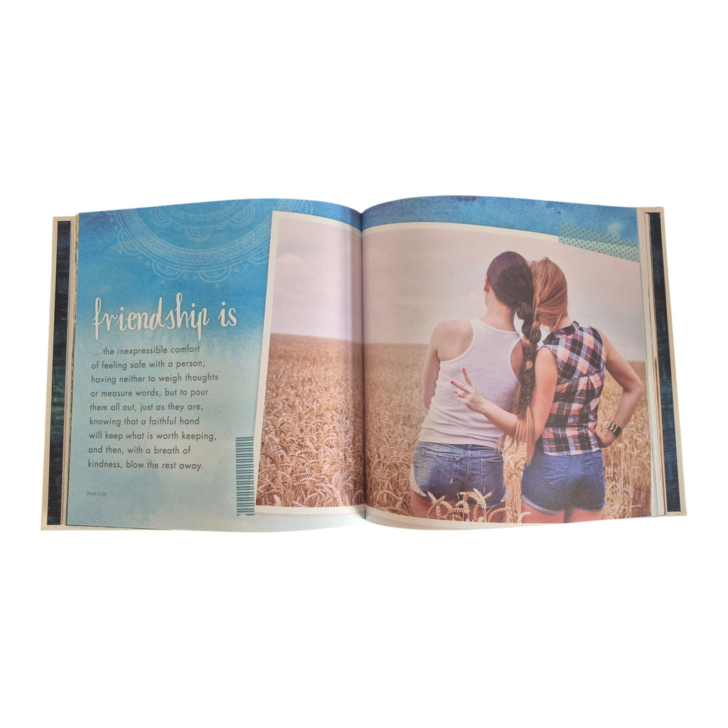 Girlfriends An Unbreakable Bond hardback book — open spread showing full-colour lifestyle photography of two women in a field alongside a Dinah Craik friendship quotation