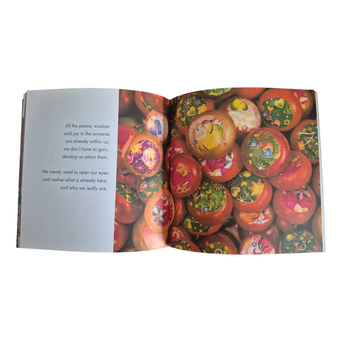 Soul Heart Mind Body Spirit hardback book by Suzanne Maher — open spread showing full-colour photography of painted decorative balls alongside a mindfulness quotation about peace wisdom and joy