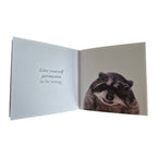 Believe in Yourself hardback book — open spread showing full-colour photograph of a raccoon alongside the quote Give yourself permission to be wrong on a clean white page