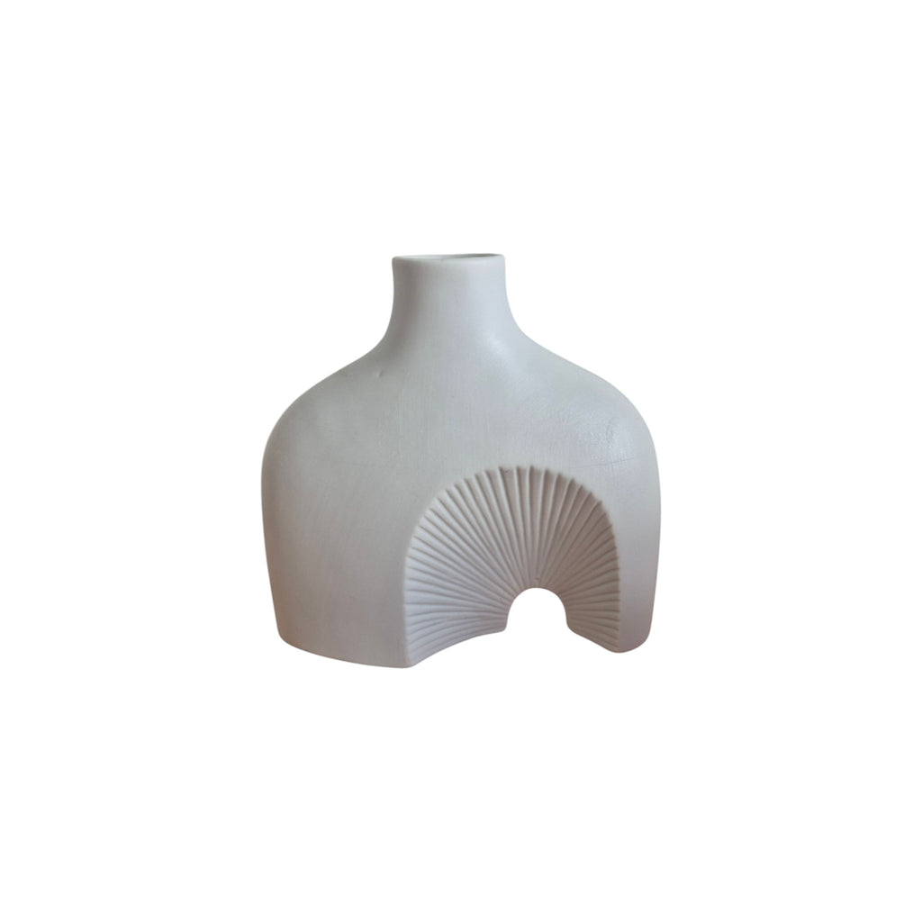 White Ceramic Abstract Vase front view showing architectural silhouette with carved radiating fan arch detail