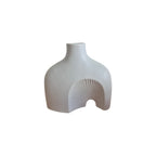 White Ceramic Abstract Vase front view showing architectural silhouette with carved radiating fan arch detail