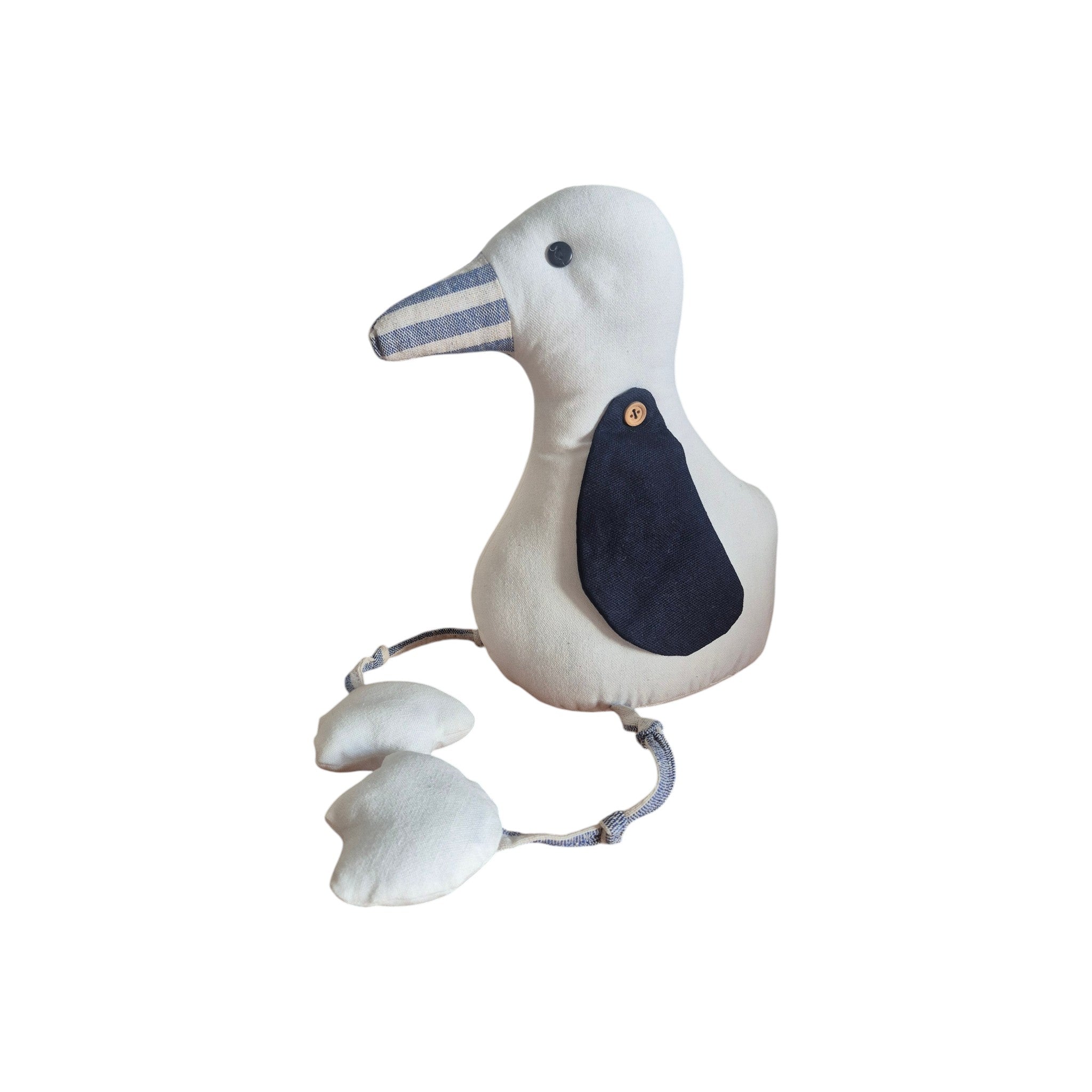LaVida Seagull Doorstop side view showing natural cream linen fabric seagull with navy wing patch, wooden button, striped beak, rope legs and webbed feet