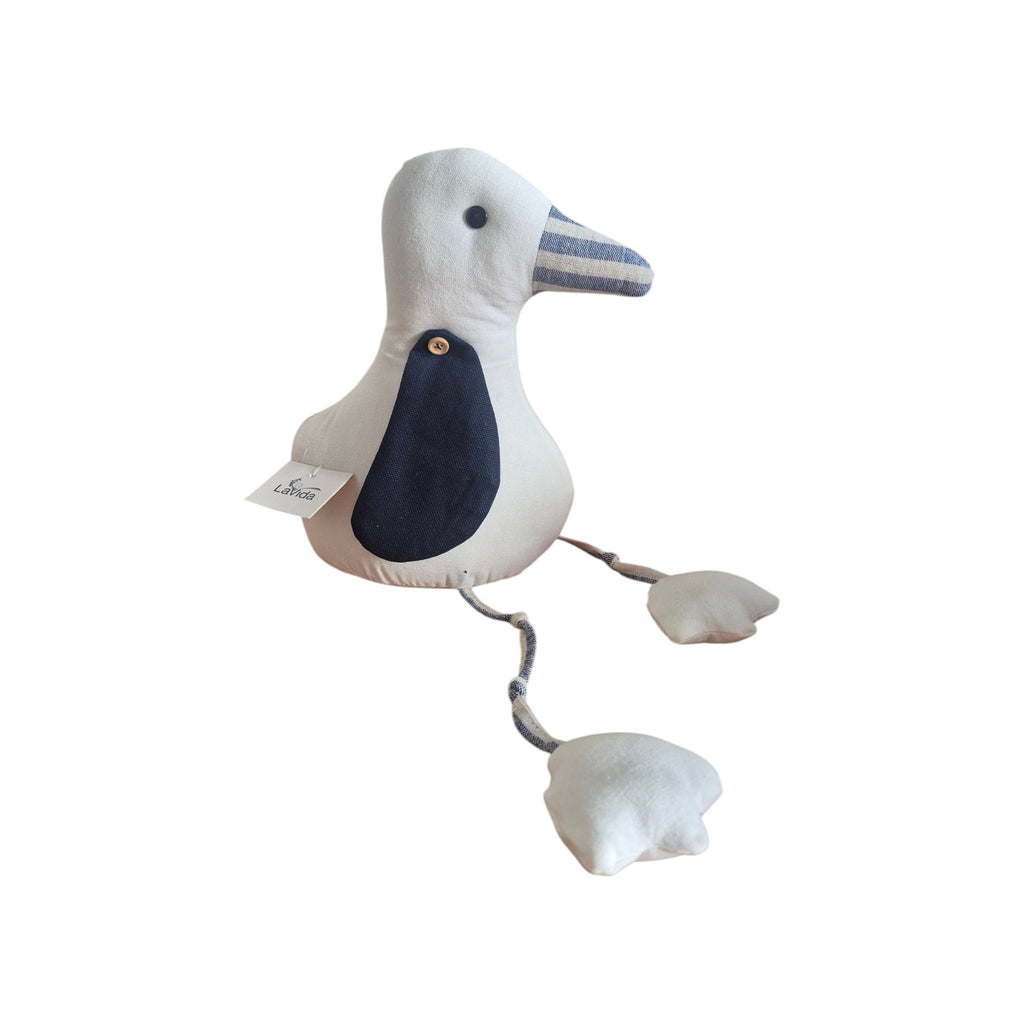 LaVida Seagull Doorstop angled view showing LaVida label, navy wing detail with wooden button and striped fabric beak on cream linen body