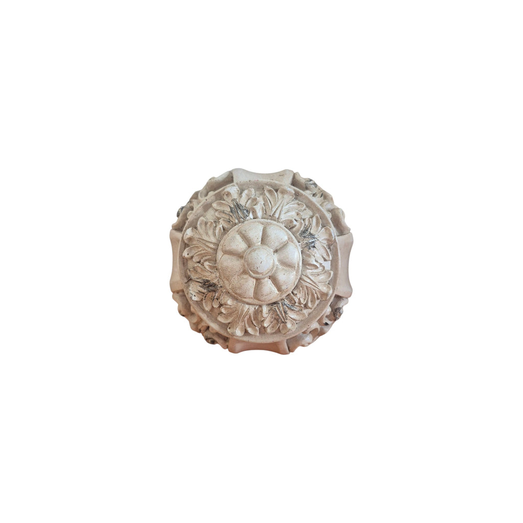 Ivory Scroll Decorative Ball top view showing raised floral sunburst medallion centrepiece surrounded by carved acanthus leaf detail