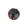 Musical Notes Decorative Ball top down view showing full arrangement of raised gold musical notes and staff lines on matte black surface