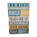 Be Kind wooden sign — distressed multi-panel timber board featuring inspirational words including Be Kind, Smile, Dream, Never Give Up, Believe, Laugh and Love in teal, yellow, white and grey, 60cm x 40cm