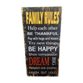 Family Rules wooden sign — distressed dark black timber board with bold yellow heading and white and red lettering listing family rules including Be Thankful, Be Happy, Dream Big, Laugh Out Loud, 60cm x 30cm. nz
