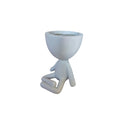 White yoga-sitting Egghead Planter, front view