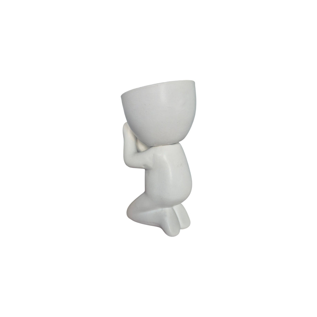 White Faithful Egghead Planter, kneeling view