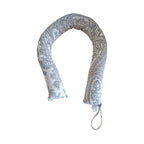 Beige patterned draught stopper 82cm laid straight with hanging loop visible