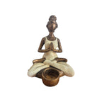 Front view of cream Yoga Lady tealight holder with hands together and cup in front