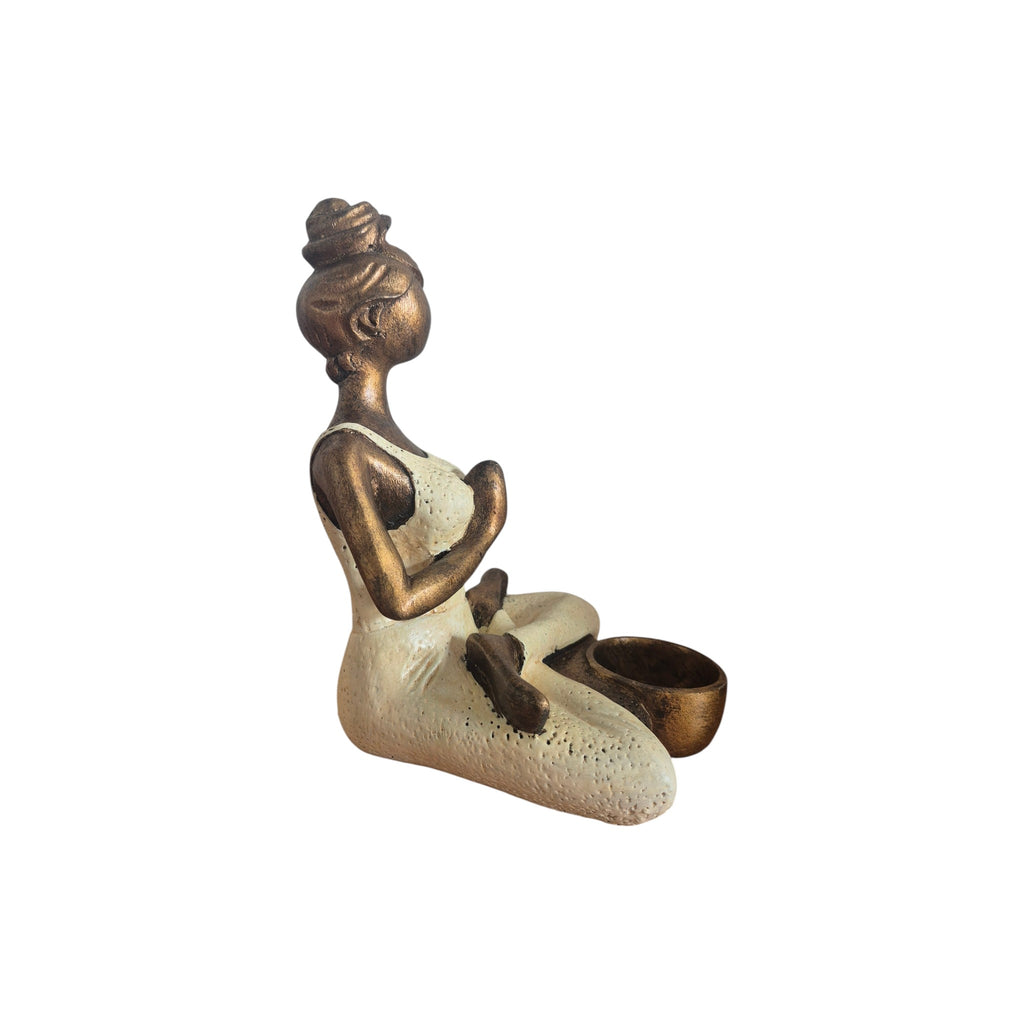 Side view of cream and bronze-coloured Yoga Lady tealight holder