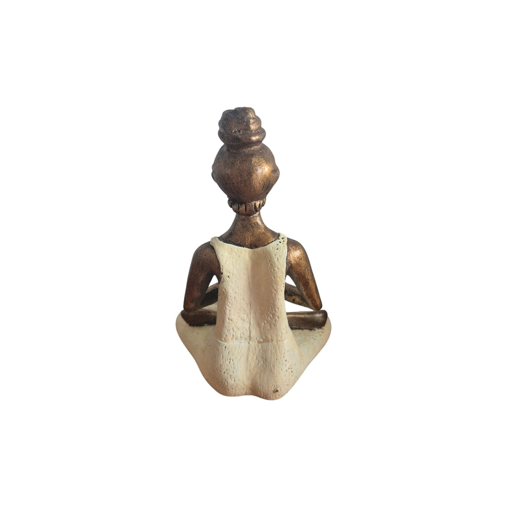 Back view of seated cream Yoga Lady tealight holder showing outfit and hair bun