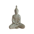 Side view of cream meditating Buddha showing tall hair ornament and draped robe