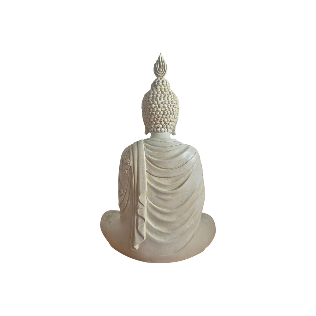 Front view of cream Buddha seated in meditation with hands in lap and ornate robe
