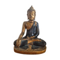 Back view of black and gold Bhumisparsha Buddha showing textured hair and dark robe