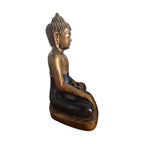 Front view of black and gold resin Bhumisparsha Buddha seated with one hand touching earth