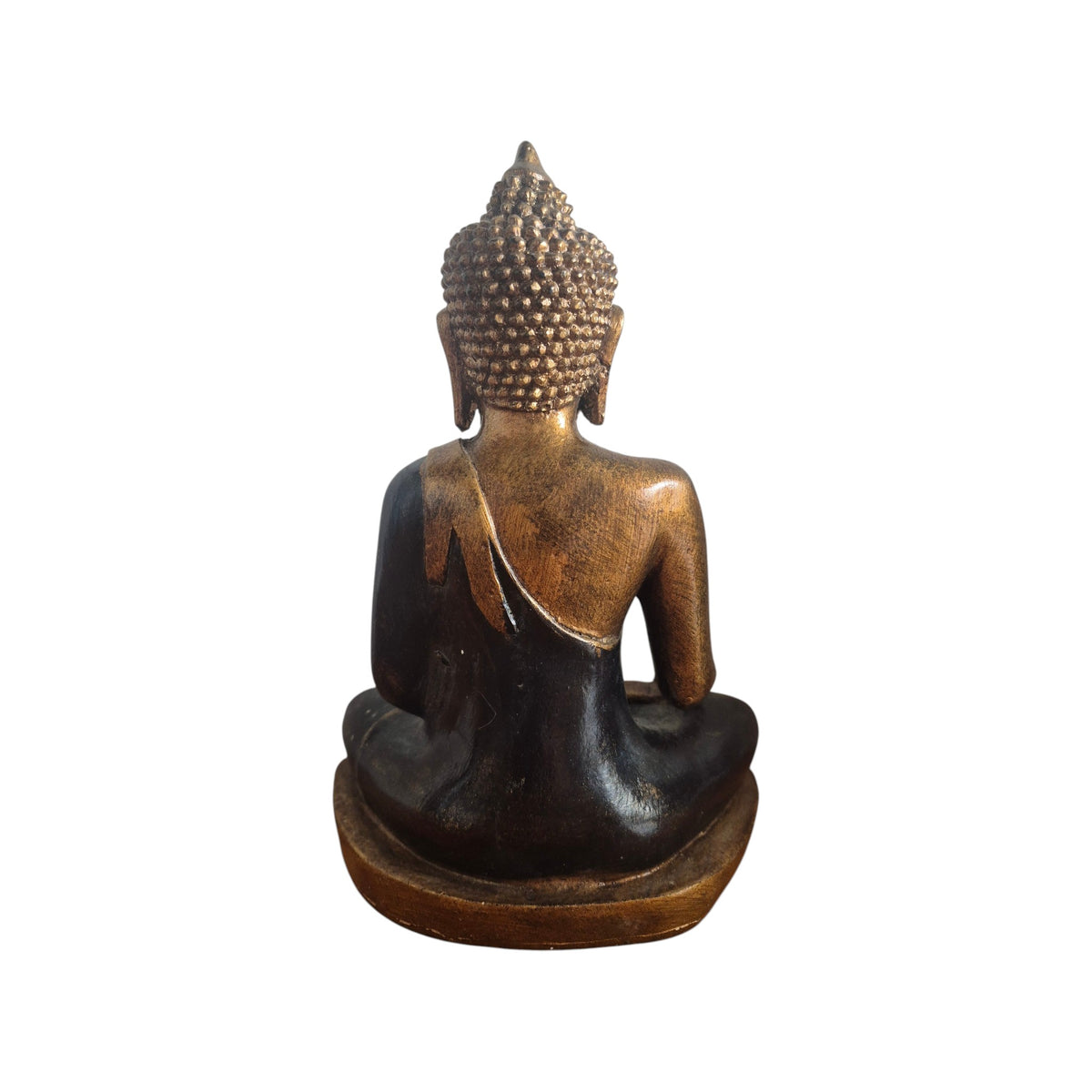 Side view of black and gold seated Buddha showing earth-touching hand and robe