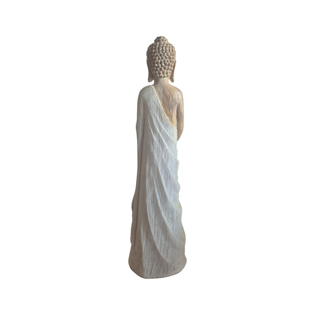 Side view of standing wood-look Buddhist statuette with draped pale robe