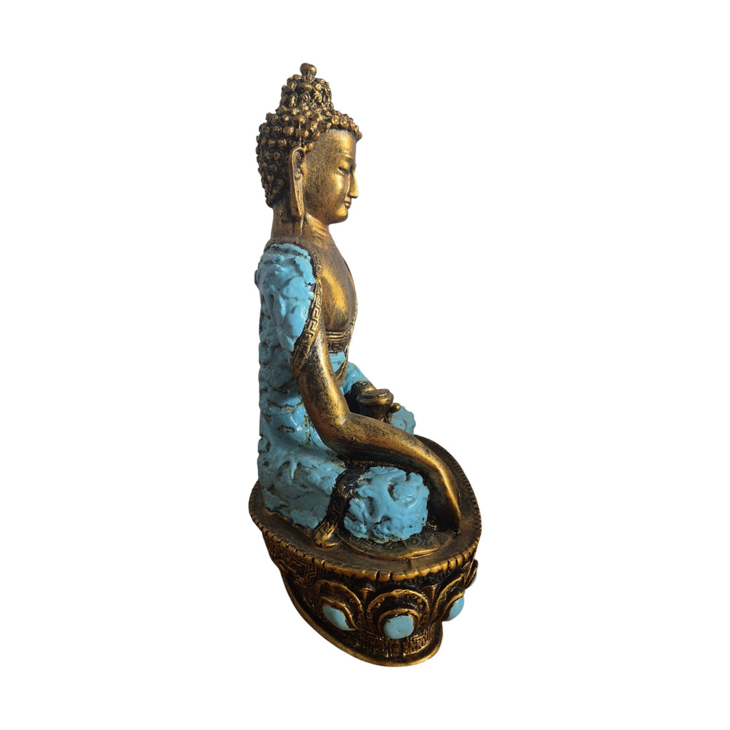 Front view of turquoise and gold-coloured resin Buddha holding a small bowl
