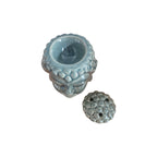 Back view of crackle-glaze Buddha head oil burner showing tealight opening