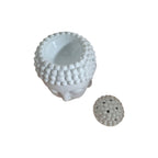 Front view of white Buddha head oil burner with serene face and textured hair
