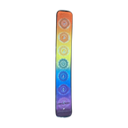 Top of ceramic incense holder with seven rainbow chakra symbols and incense stick hole